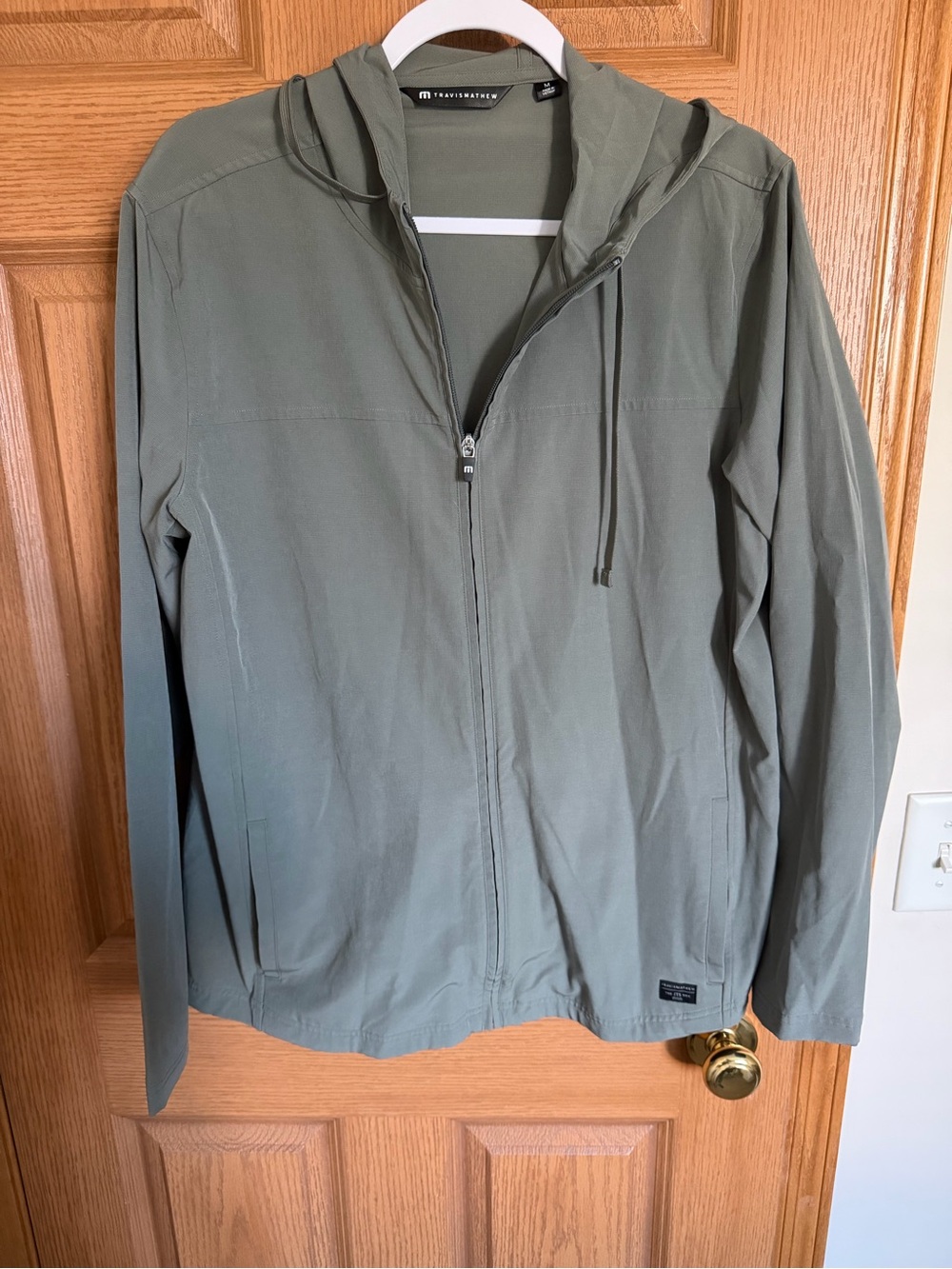 Travis Mathew Lightweight Hooded Jacket in Olive